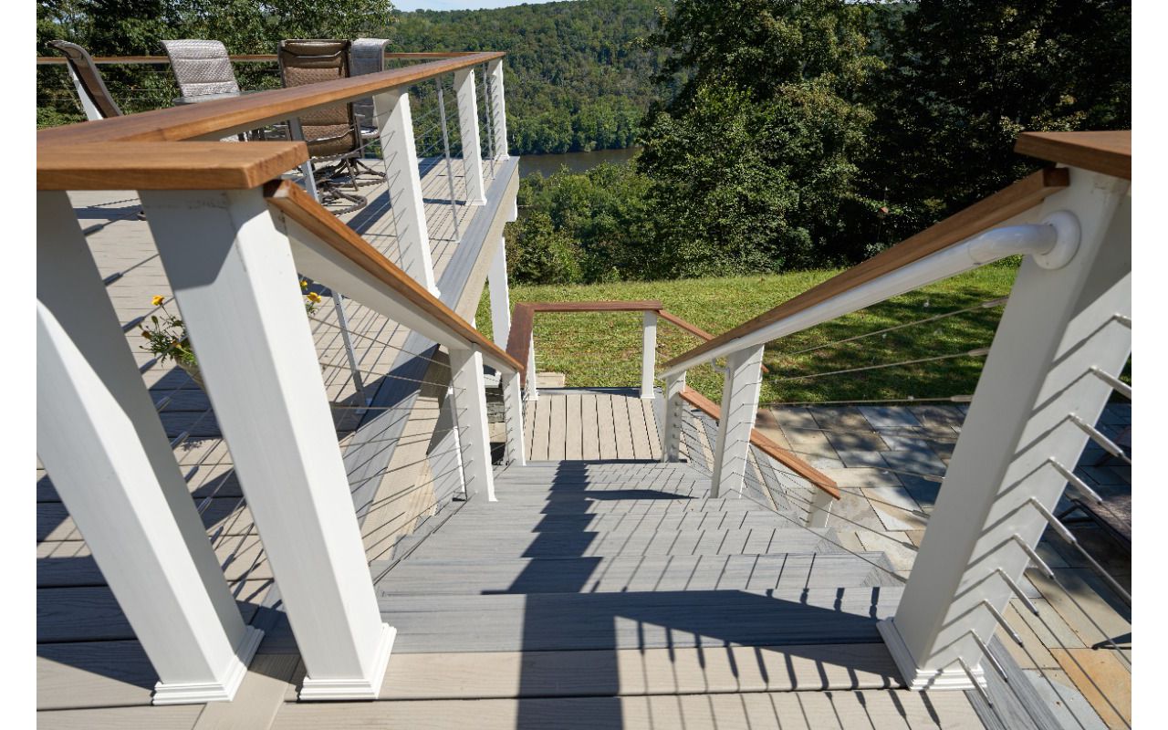 Stylish Trex deck with seamless stair design, offering a smooth transition from your home to your outdoor space with lasting durability.