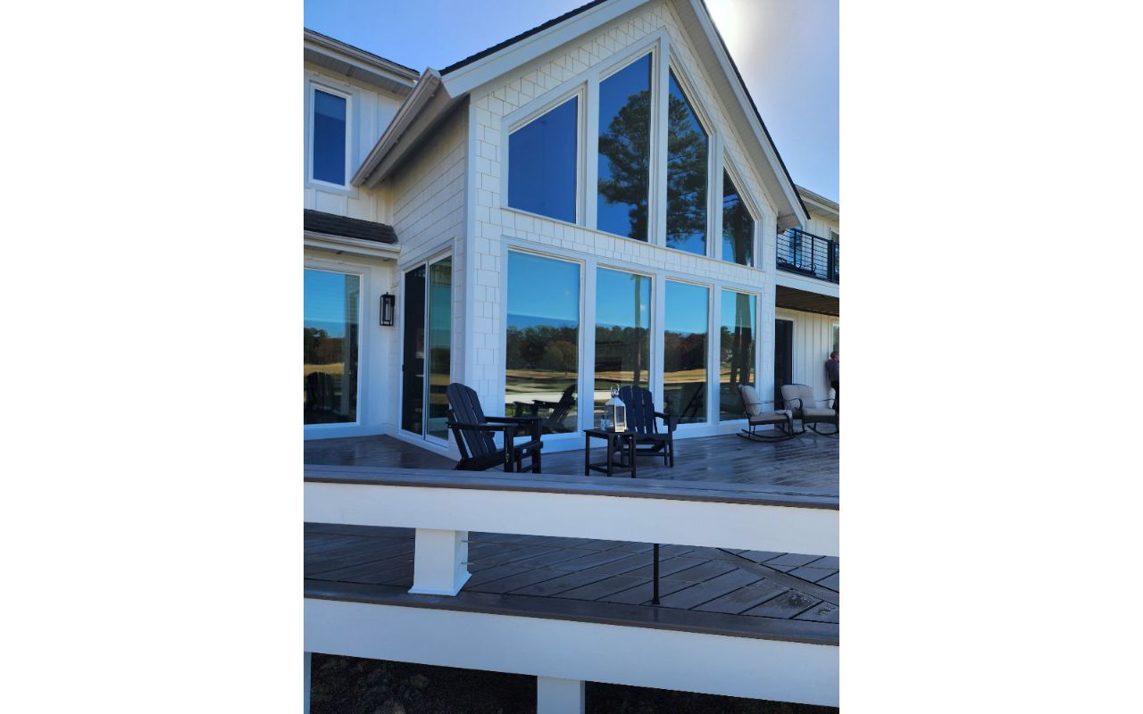 Custom Wrap-Around Bench Surrounding a Beautiful Trex Transcend Linage Biscayne Deck