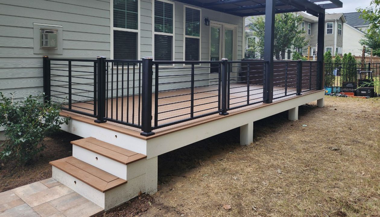 Trex Rod Rail Railings Connected to a Custom Black Aluminum Pergola, Apex NC