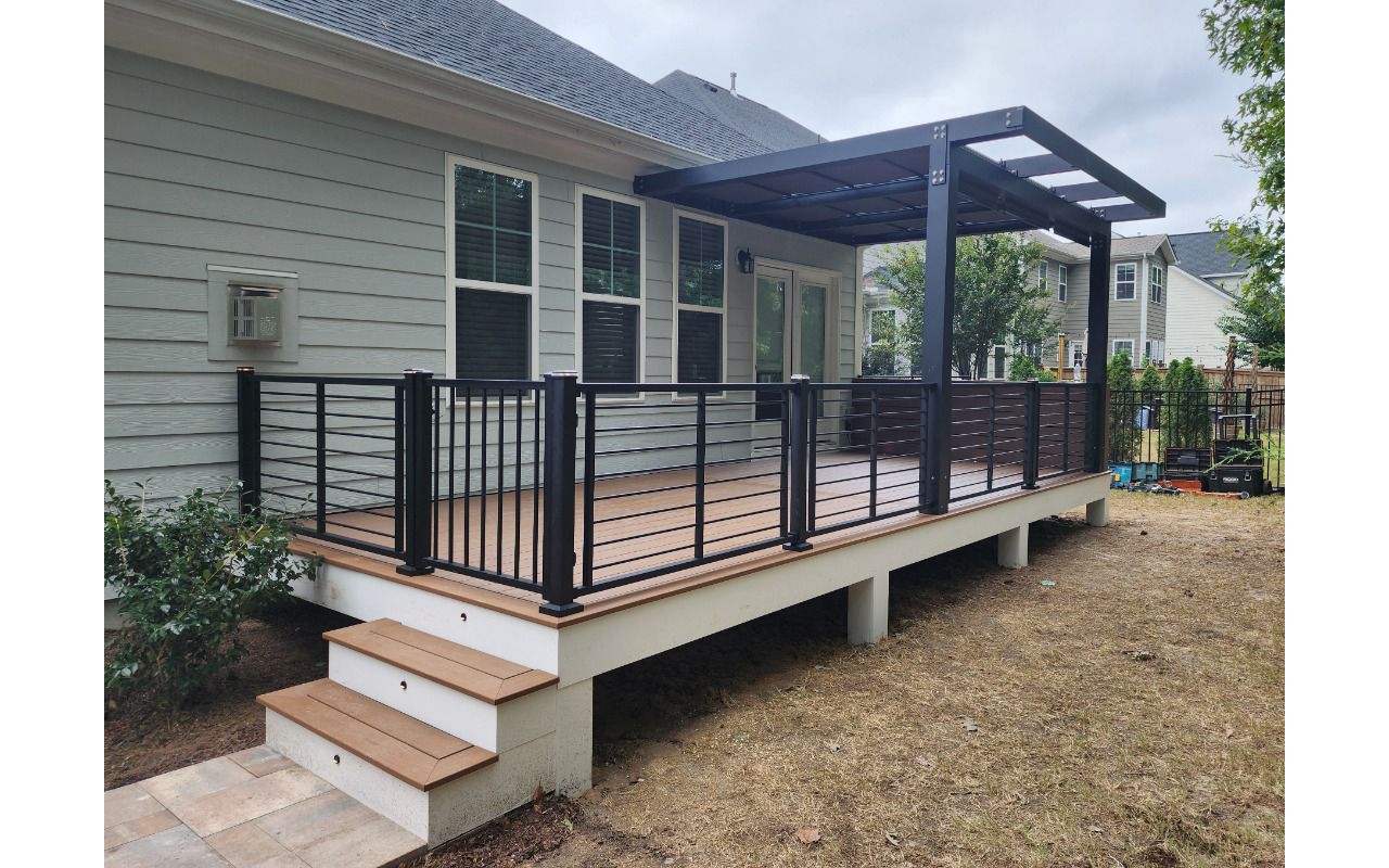 Trex Rod Rail Railings Connected to a Custom Black Aluminum Pergola, Apex NC
