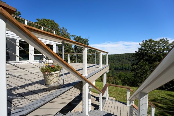 Experience outdoor living at its finest with this beautiful Trex deck, offering a stunning view and low maintenance elegance for years to come.