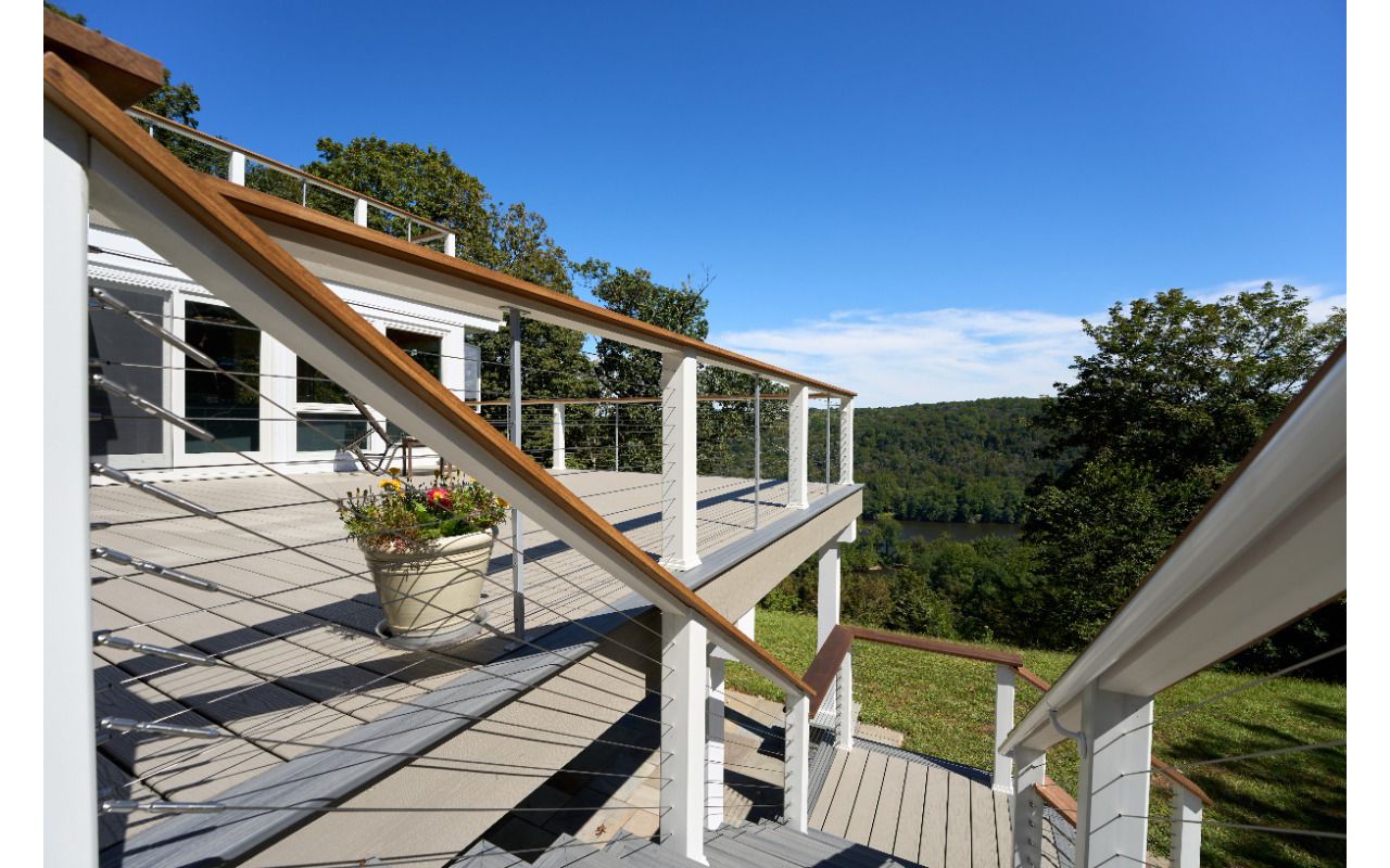 Experience outdoor living at its finest with this beautiful Trex deck, offering a stunning view and low maintenance elegance for years to come.