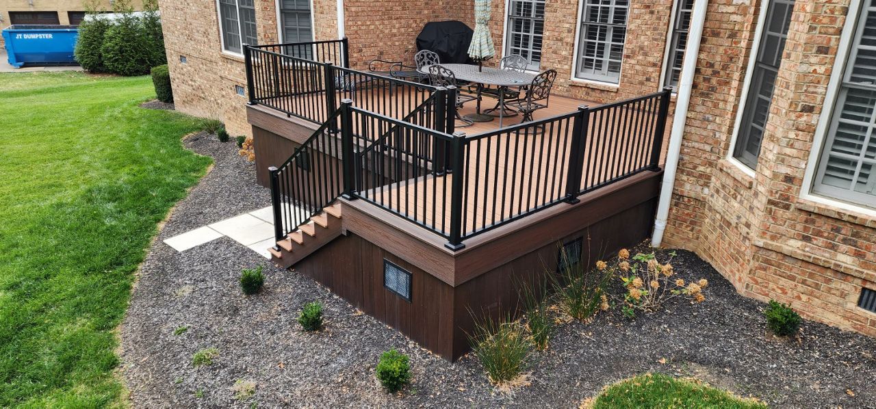 Trex deck at a home in Brentwood, TN with Trex Signature handrails, Trex lighting and Trex fascia on the skirt area