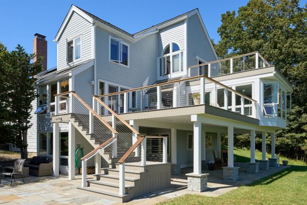 Elevate your outdoor living with this multi-level Trex deck, featuring layered spaces for relaxation and entertainment, all with the durability of composite decking.