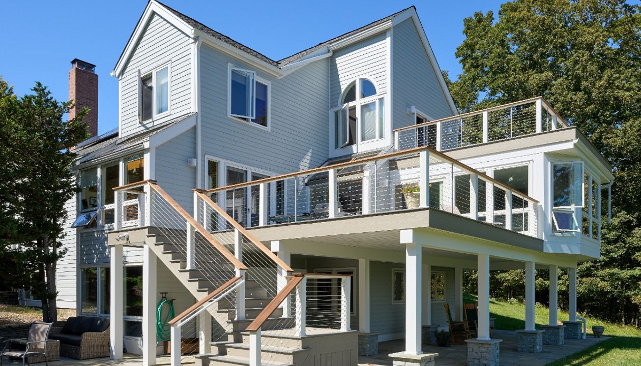 Elevate your outdoor living with this multi-level Trex deck, featuring layered spaces for relaxation and entertainment, all with the durability of composite decking.