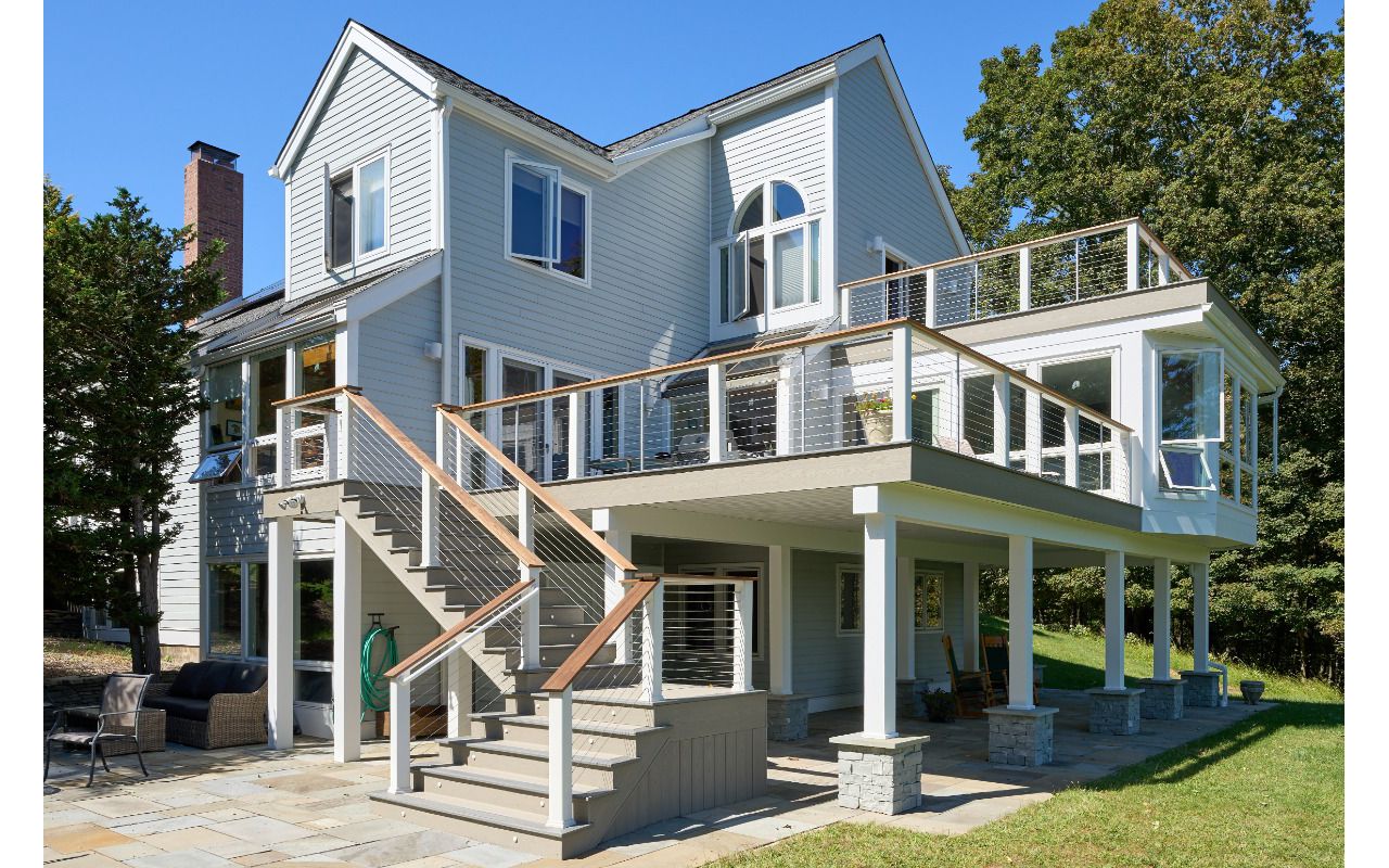 Elevate your outdoor living with this multi-level Trex deck, featuring layered spaces for relaxation and entertainment, all with the durability of composite decking.