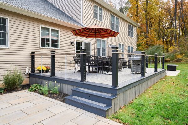 Timeless beauty meets low-maintenance convenience with this Trex deck, offering a stylish and durable outdoor space for years of enjoyment