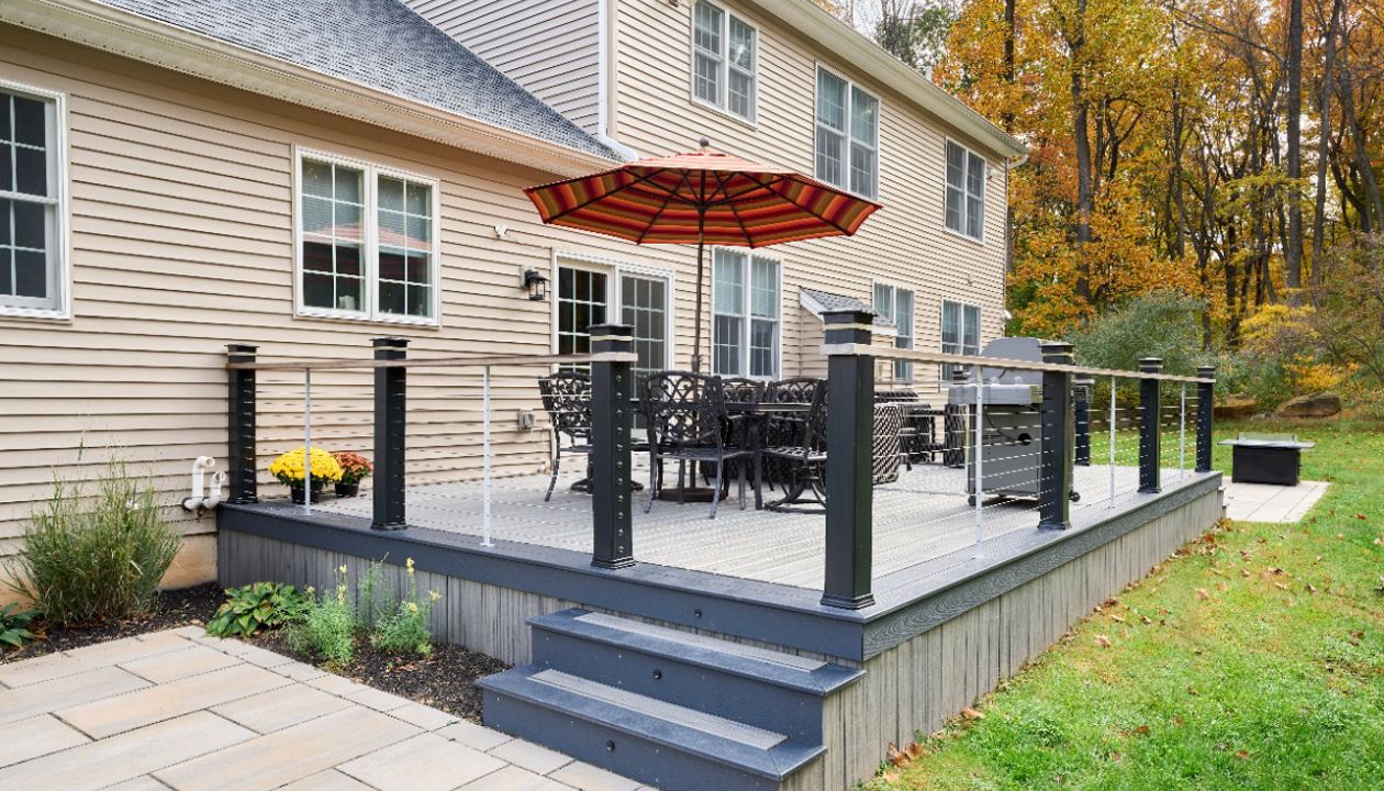 Timeless beauty meets low-maintenance convenience with this Trex deck, offering a stylish and durable outdoor space for years of enjoyment