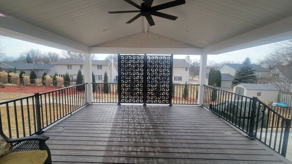 Spiced Rum decking with white trim and privacy panels