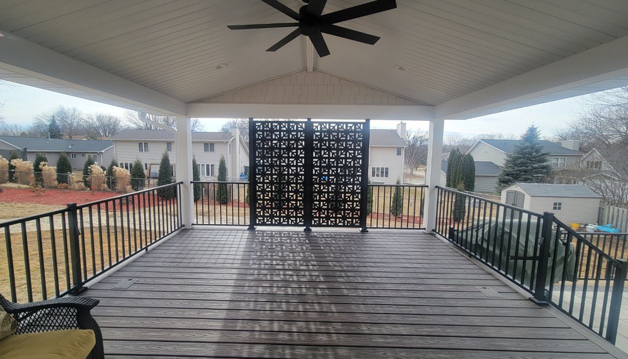 Spiced Rum decking with white trim and privacy panels