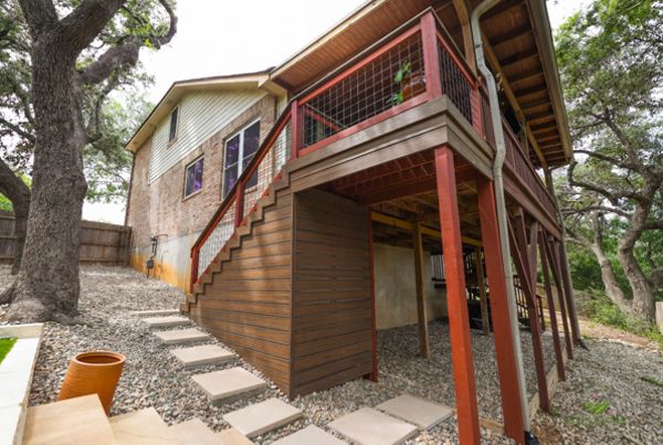 Elevated Trex deck and stairs with privacy skirting on a sloped San Antonio lot