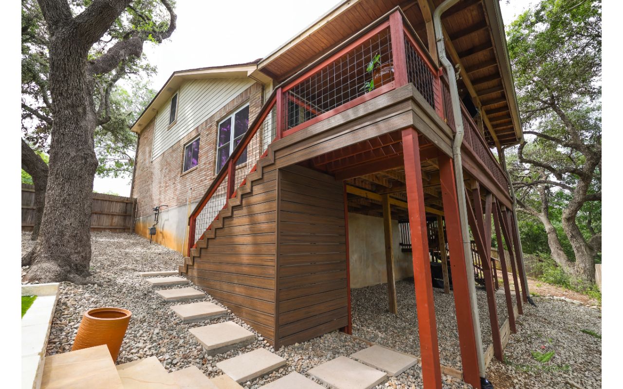 Elevated Trex deck and stairs with privacy skirting on a sloped San Antonio lot