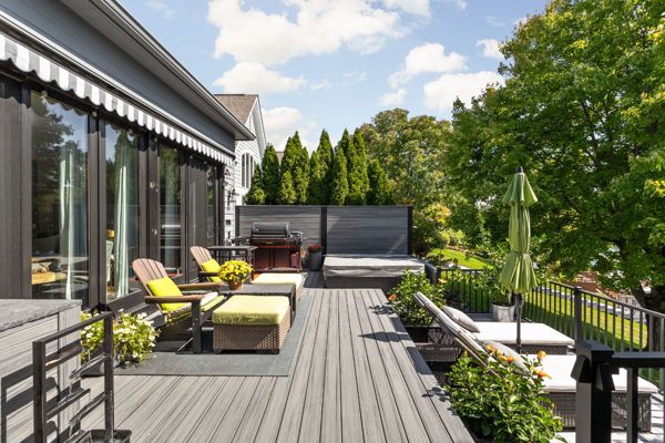 Trex Deck in Island Mist and Signature Rail. Custom Trex privacy panel