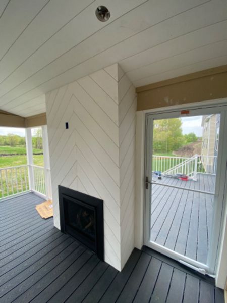 A welcoming retreat featuring white shiplap throughout