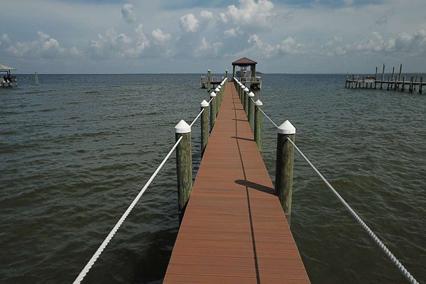 Boat docked at a dock made of Trex decking