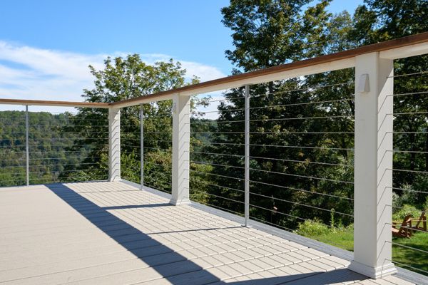 Modern and sleek Trex deck with durable cable wire railing, perfect for enjoying outdoor views with a contemporary touch