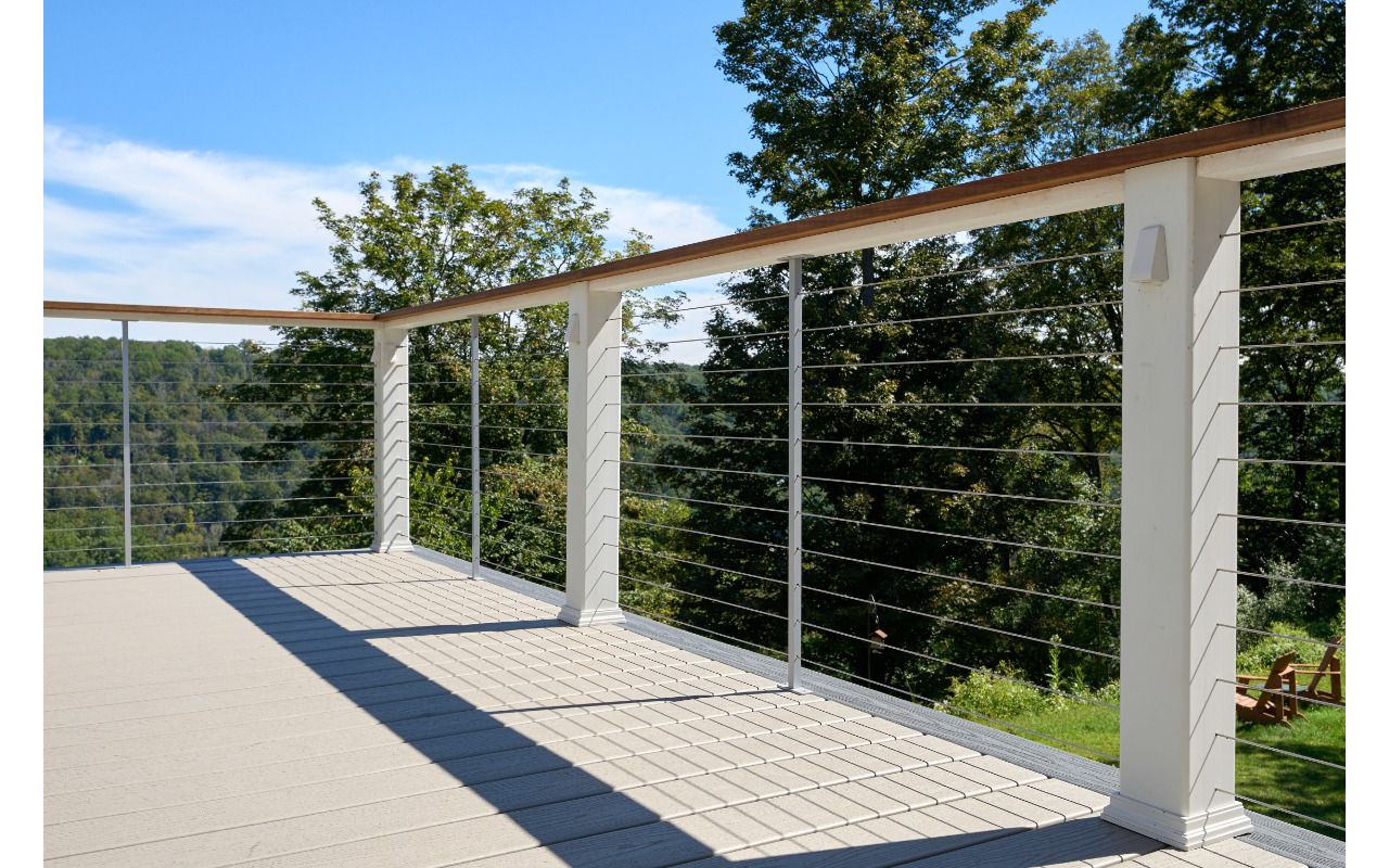 Modern and sleek Trex deck with durable cable wire railing, perfect for enjoying outdoor views with a contemporary touch