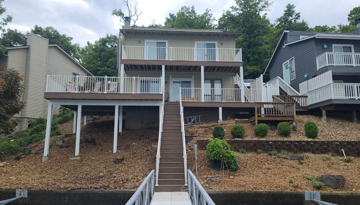 Deck using Toasted Sand and Coastal Bluff with Signature railing and LED post cap lights done in Lake Ozark, MO