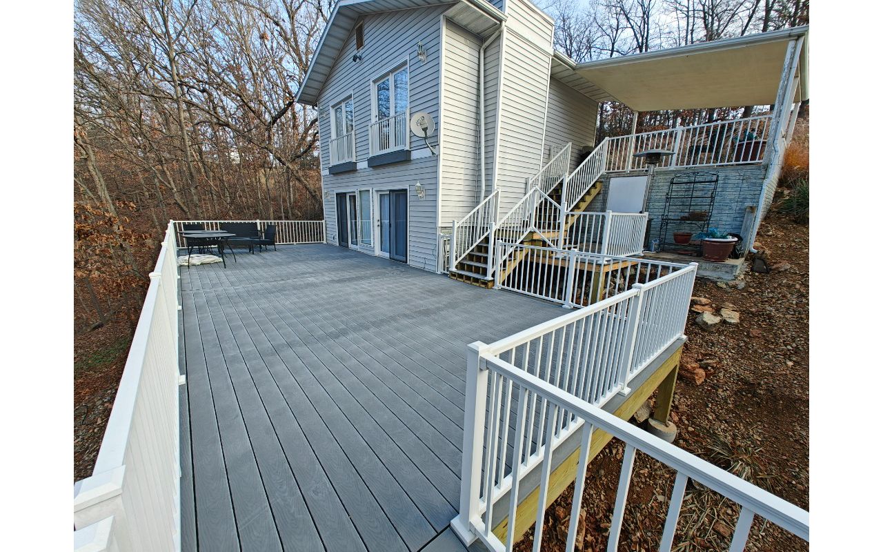 Massive deck using Pebble Gray with Signature railing done in Laurie at Lake of the Ozarks