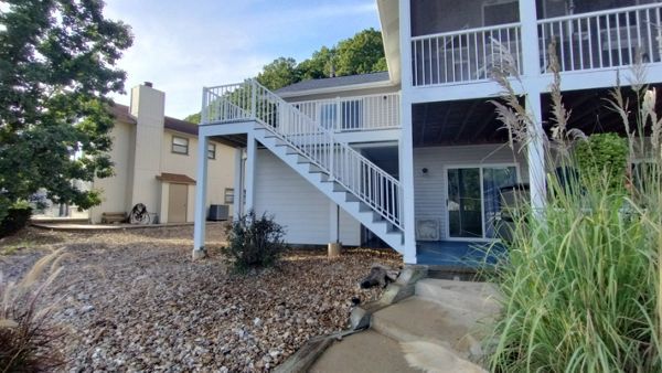 Great Deck with built in storage underneath. Deck with build with Foggy Wharf, Rainescape and Signature Railing. Done in Camdenton, MO at Lake of the Ozarks