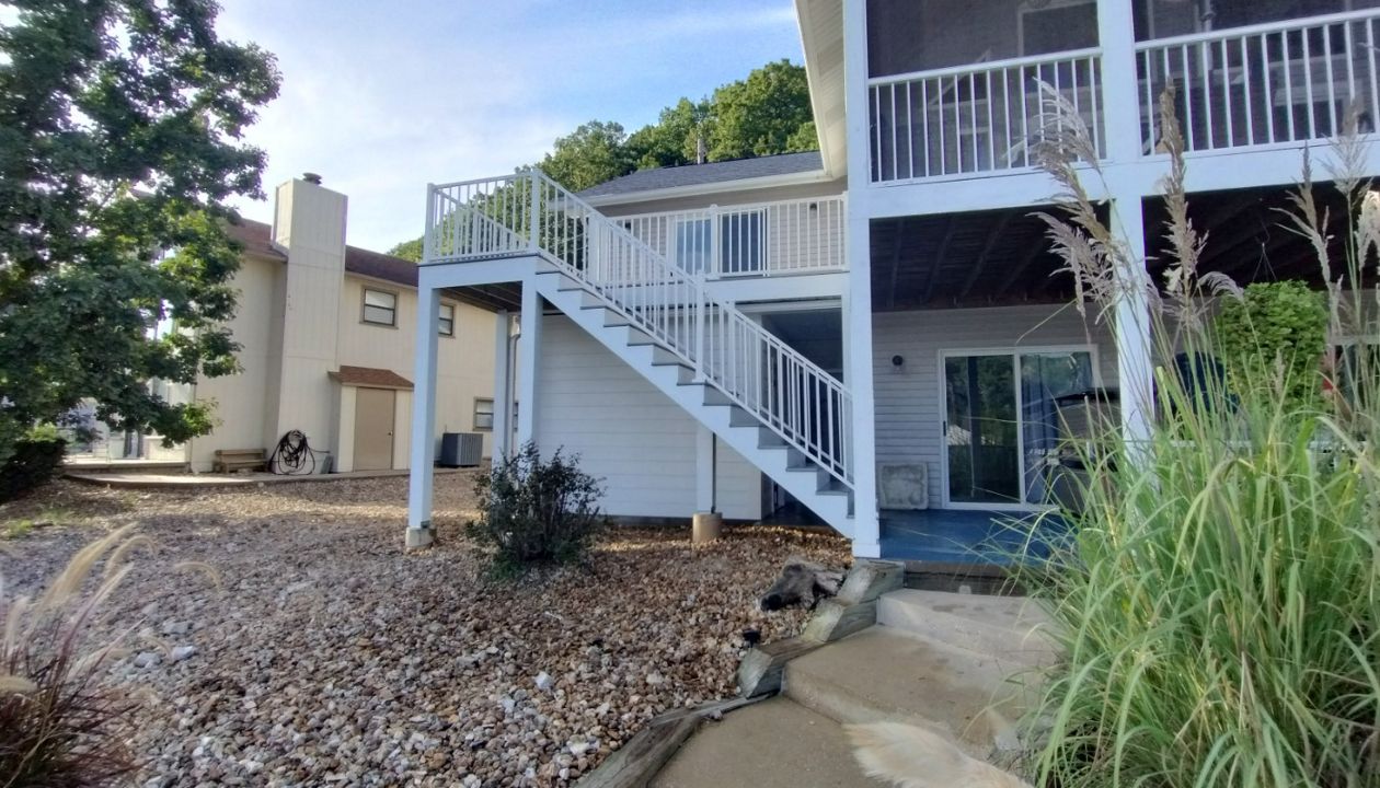 Great Deck with built in storage underneath. Deck with build with Foggy Wharf, Rainescape and Signature Railing. Done in Camdenton, MO at Lake of the Ozarks