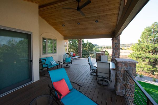 Lone Tree, CO Trex Transcend decks in Havana Gold with steel frame and custom iron railing