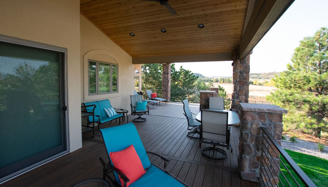 Lone Tree, CO Trex Transcend decks in Havana Gold with steel frame and custom iron railing