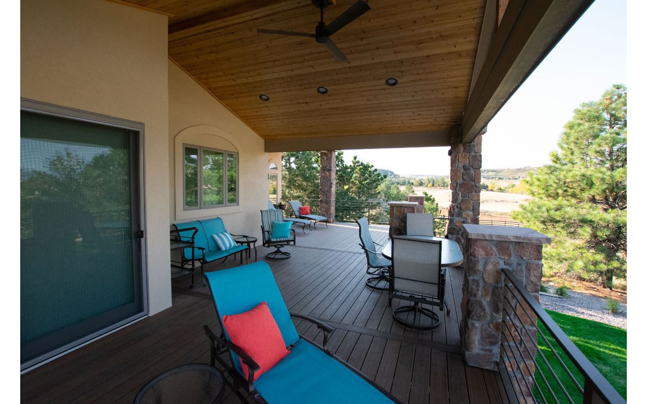 Lone Tree, CO Trex Transcend decks in Havana Gold with steel frame and custom iron railing