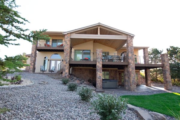 Lone Tree, CO Trex Transcend decks in Havana Gold with steel frame and custom iron railing