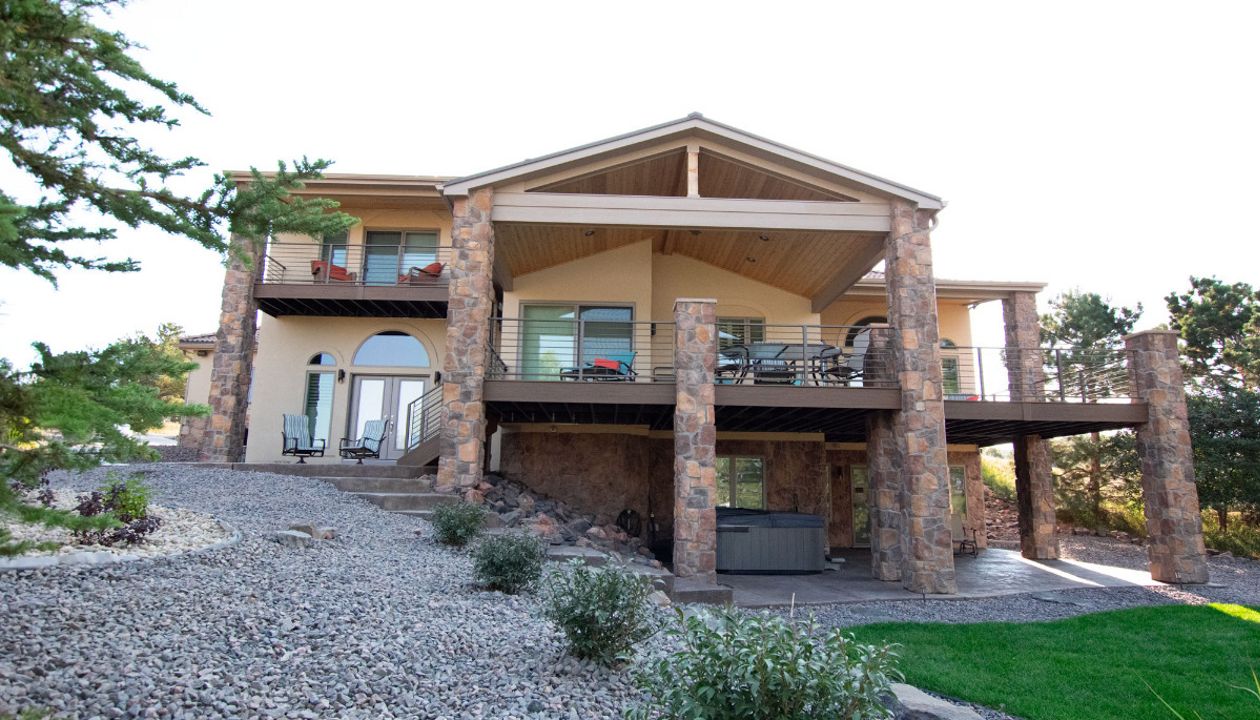 Lone Tree, CO Trex Transcend decks in Havana Gold with steel frame and custom iron railing