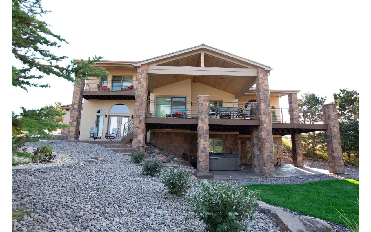 Lone Tree, CO Trex Transcend decks in Havana Gold with steel frame and custom iron railing
