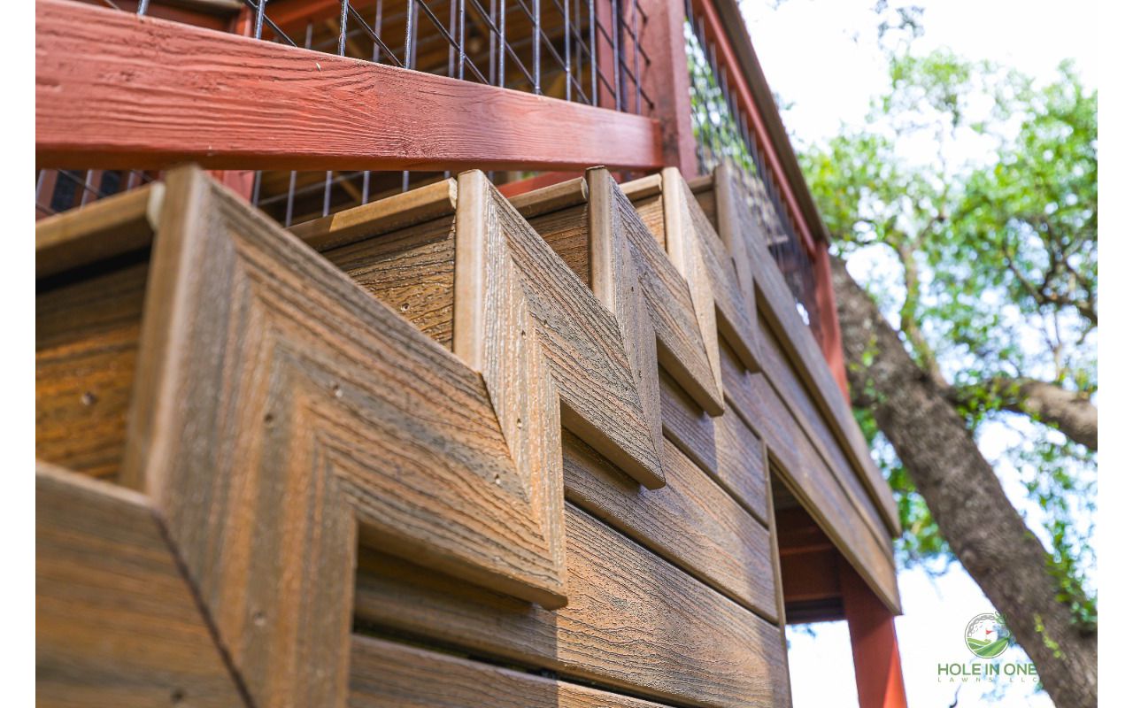 Detail of herringbone-pattern Trex skirting under an elevated deck