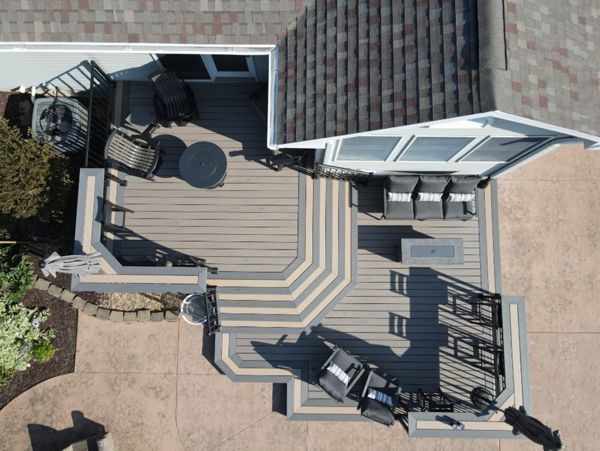 Trex Transcend Lineage Biscayne decking with Caramel & Island Mist accents.  Custom Trex bartops