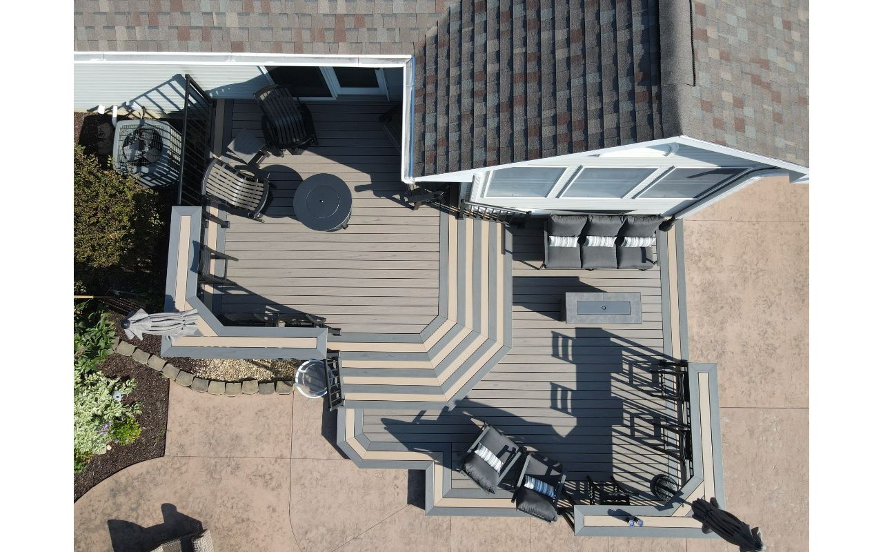 Trex Transcend Lineage Biscayne decking with Caramel & Island Mist accents.  Custom Trex bartops