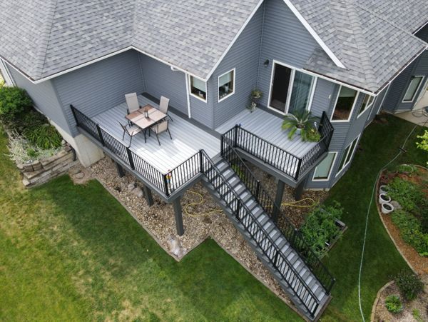 Trex Enhanced Foggy Wharf with Clam Shell border and black Trex Signature railing