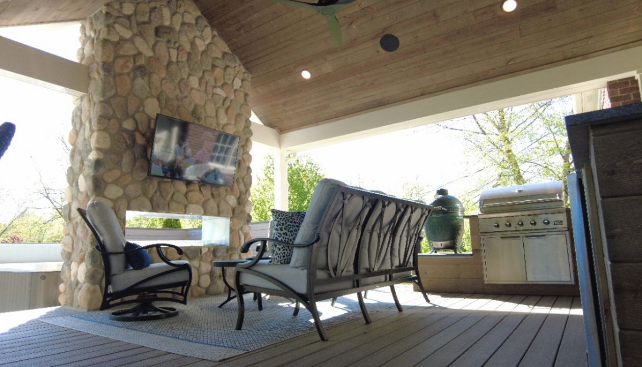 Covered deck with structure and fireplace