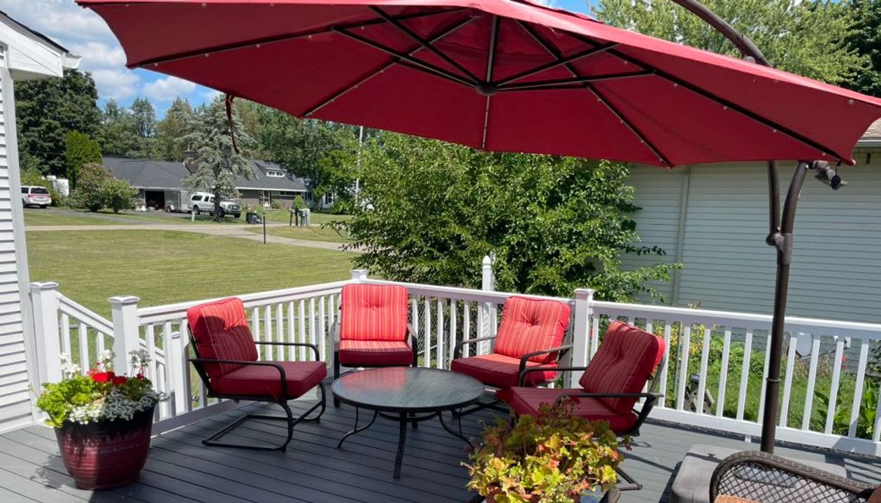 Clam Shell Decking with white railing.
