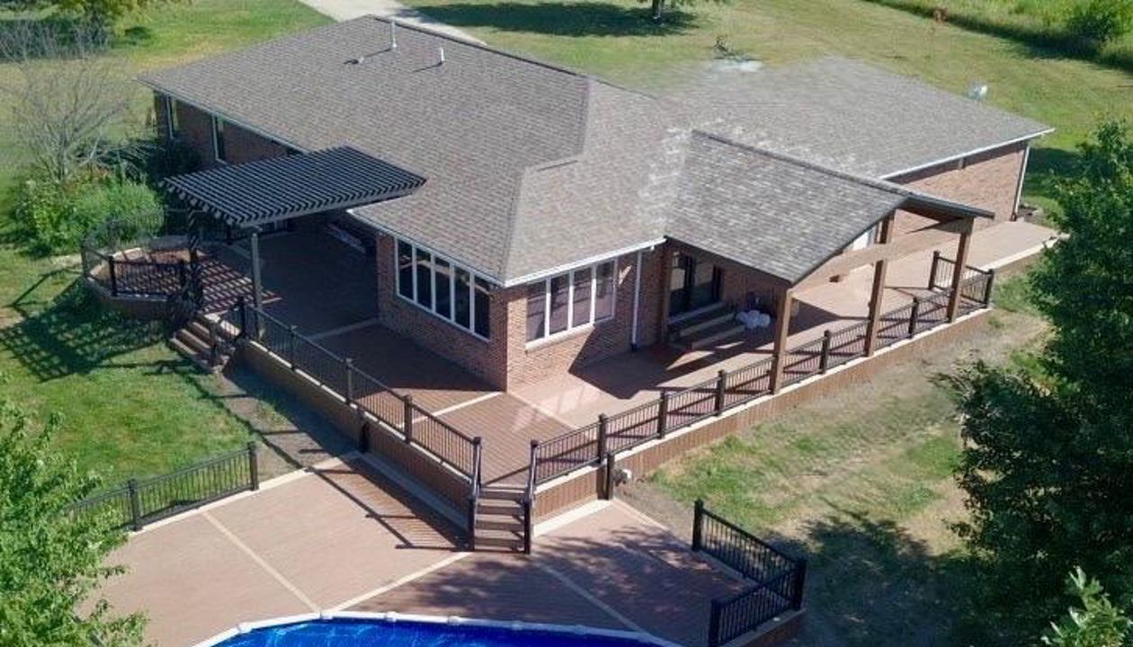Multi level Trex deck with covered porch and pergola in Bloomington IL.