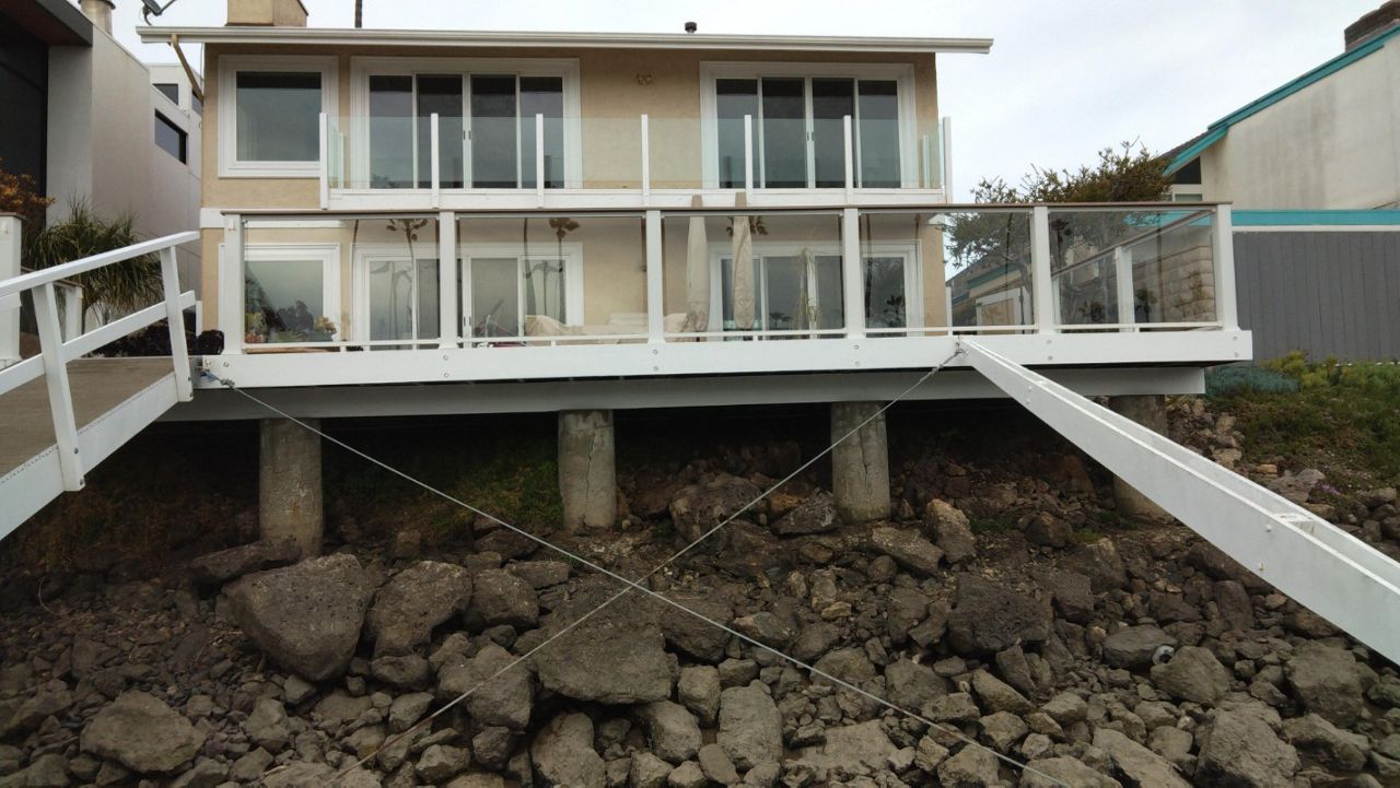 Deck over SEAWALL Trex Signature Glass Ventura