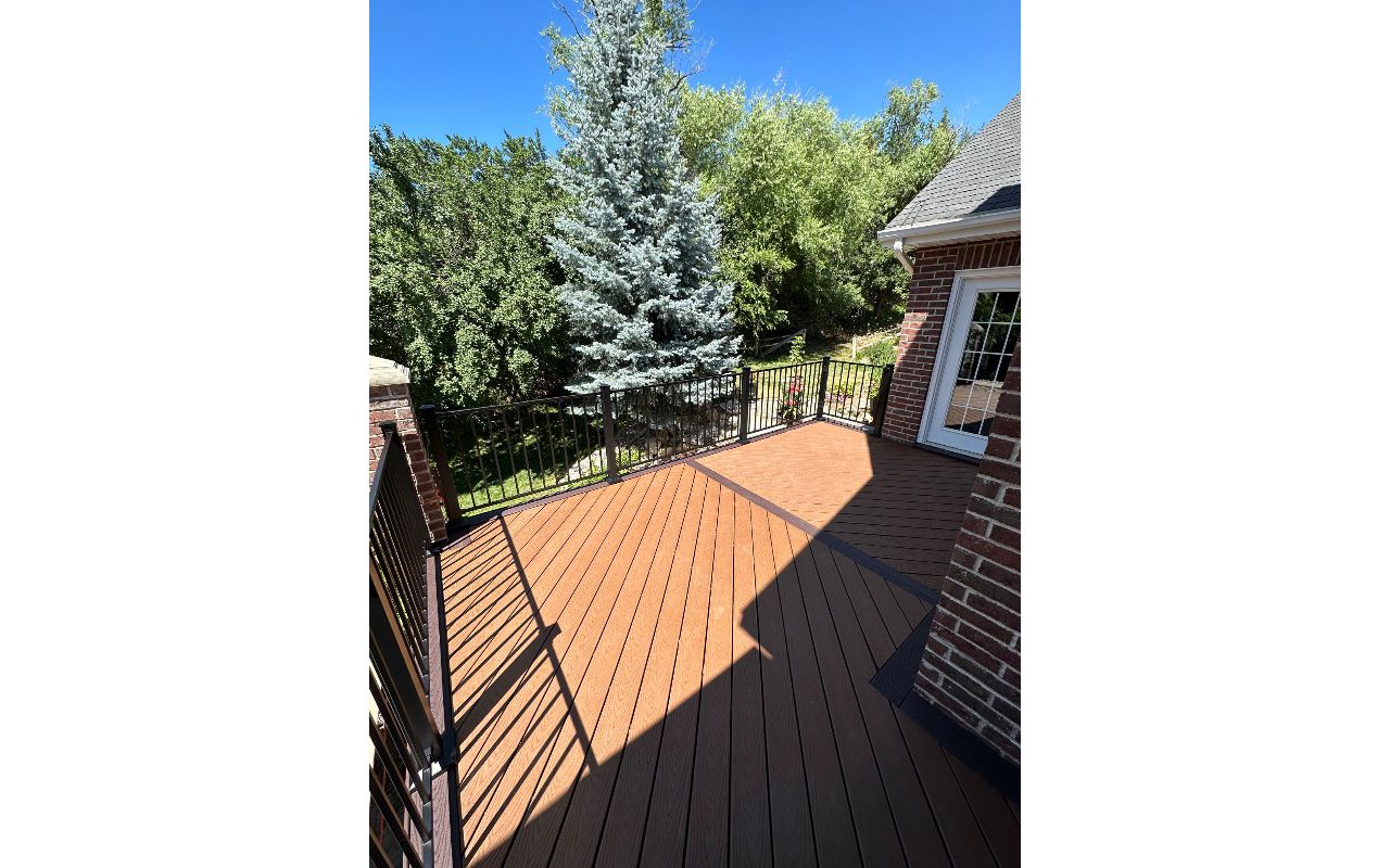 “Striking Tiki Torch decking laid at a bold 45°, framed with rich Saddle Select for contrast that commands attention — where craftsmanship meets creativity.