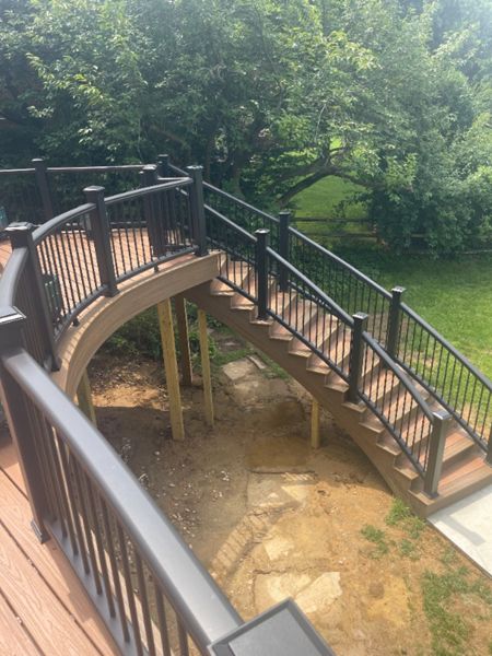 Custom build Trex Transcend stairs with Tiki Torch, Havana Gold and Charcoal Black railing