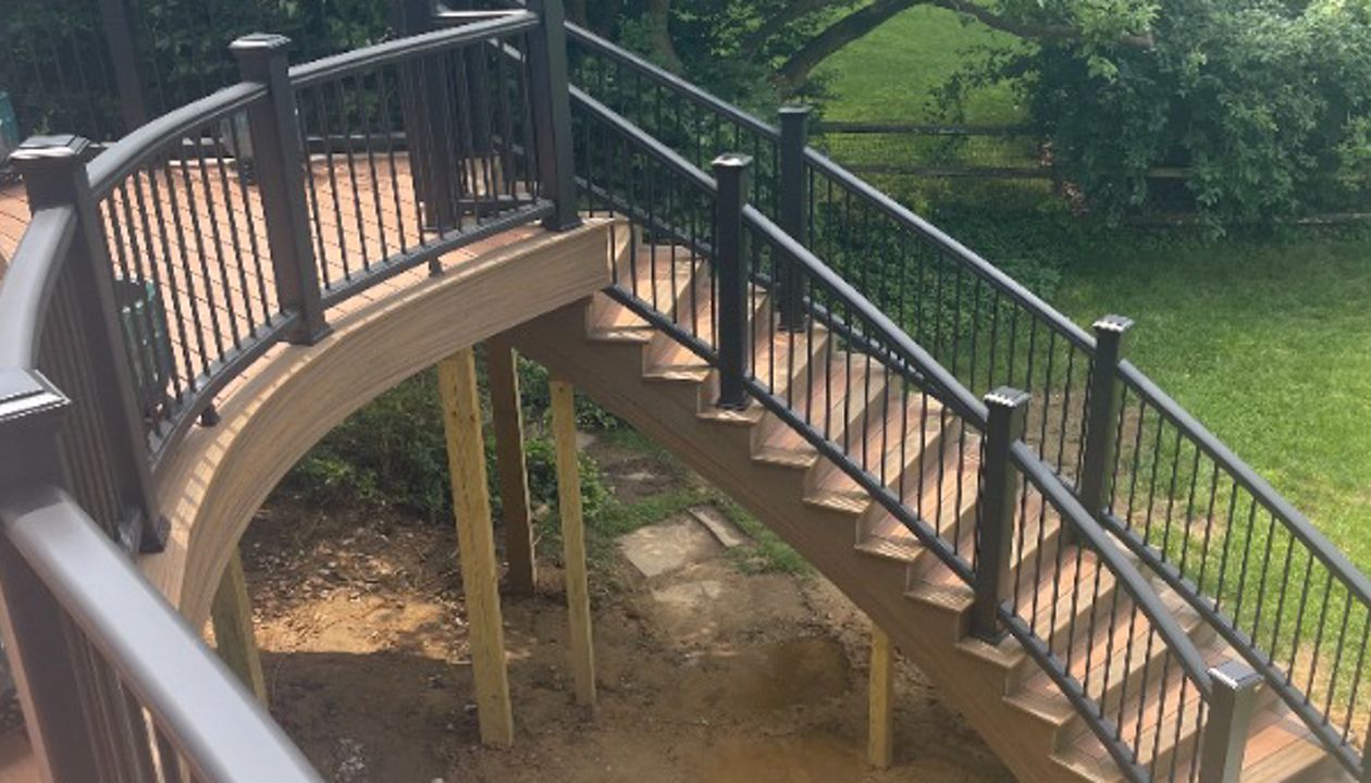 Custom build Trex Transcend stairs with Tiki Torch, Havana Gold and Charcoal Black railing