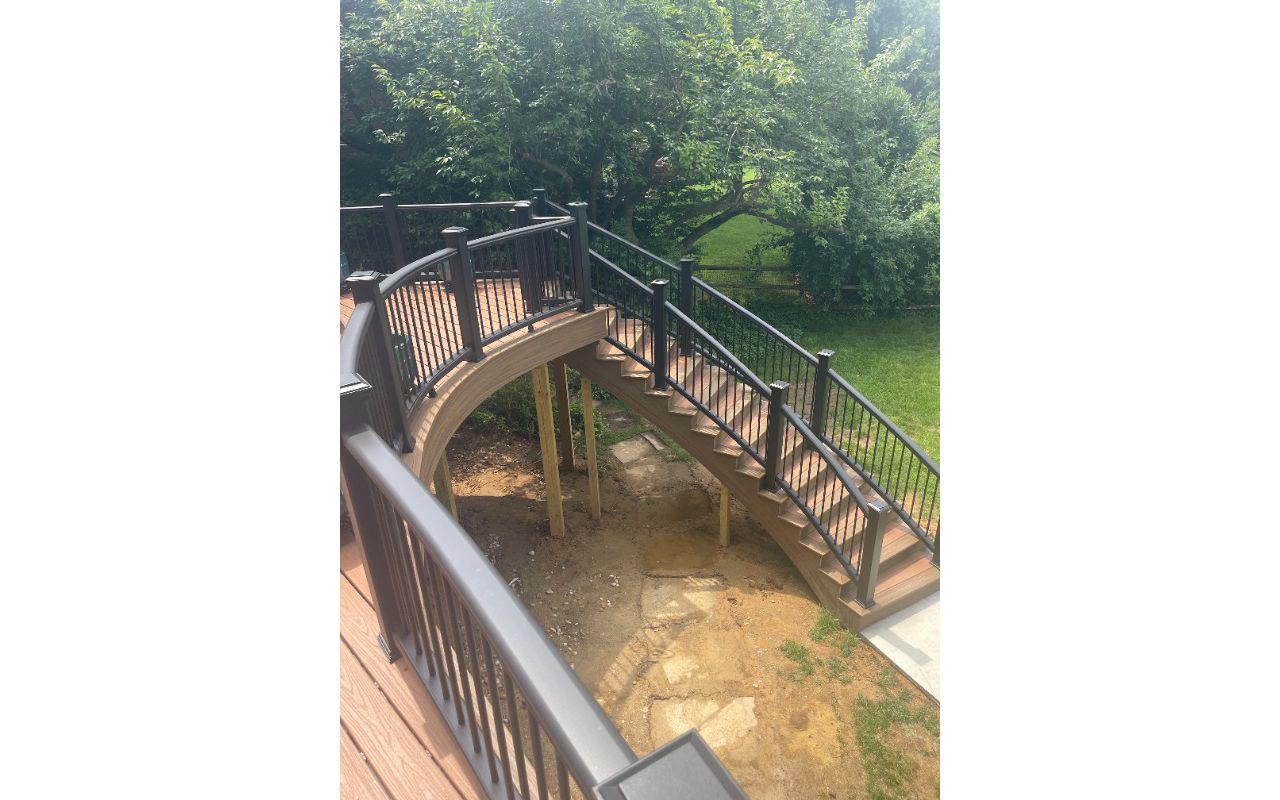 Custom build Trex Transcend stairs with Tiki Torch, Havana Gold and Charcoal Black railing