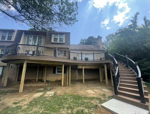 Trex Transcend Tiki Torch and Havana Gold decking with Transcend Charcoal Black railing