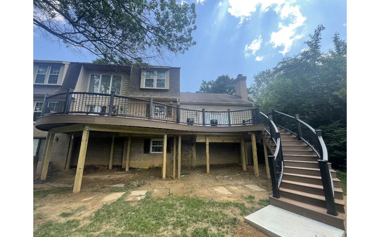 Trex Transcend Tiki Torch and Havana Gold decking with Transcend Charcoal Black railing