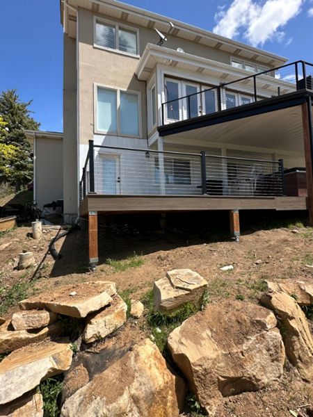 This two-story deck showcases Trex® Coastal Bluff decking paired with sleek Trex® Cable Railing — modern, durable, and built to capture the view from every level.