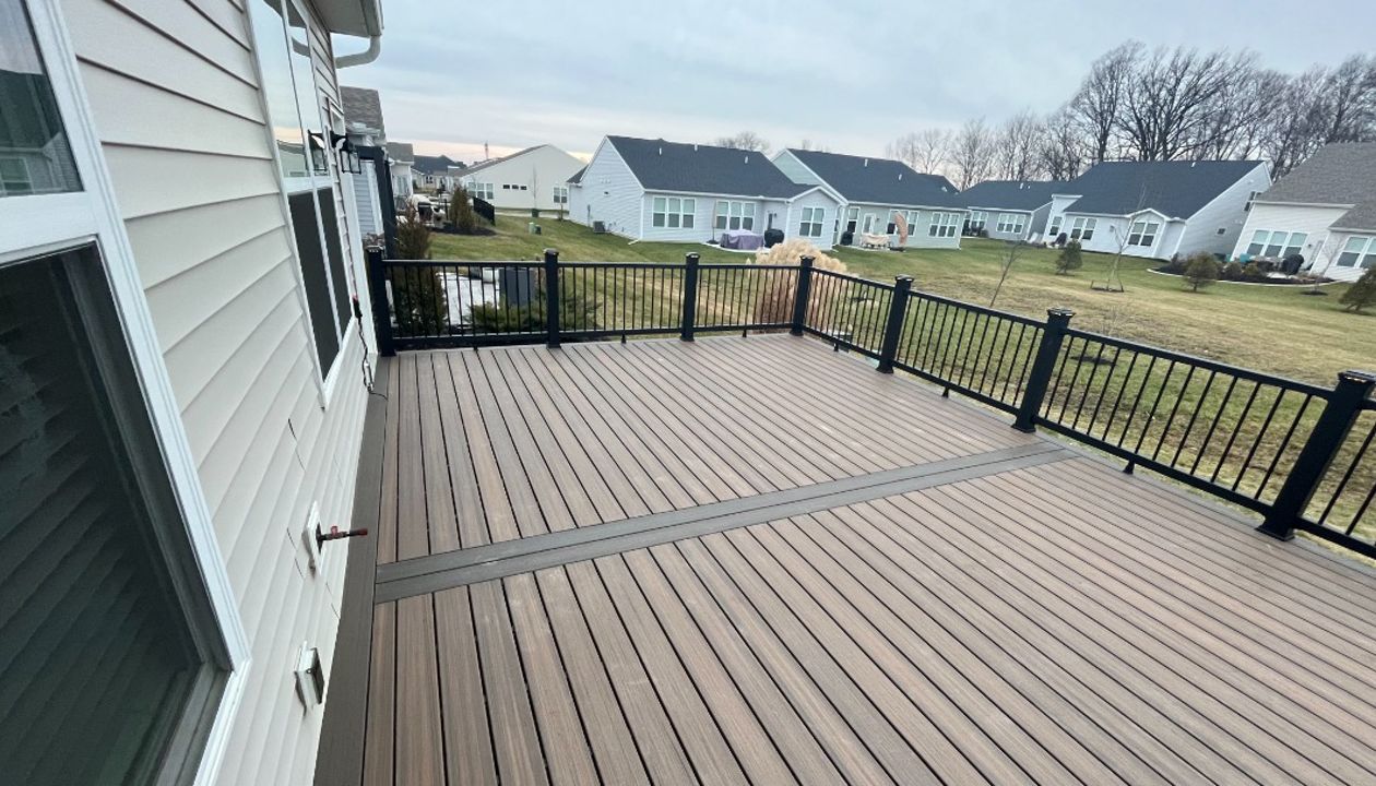 Not much can beat Toasted Sand decking complimented by Coast Bluff for the accents and Charcoal Black railing