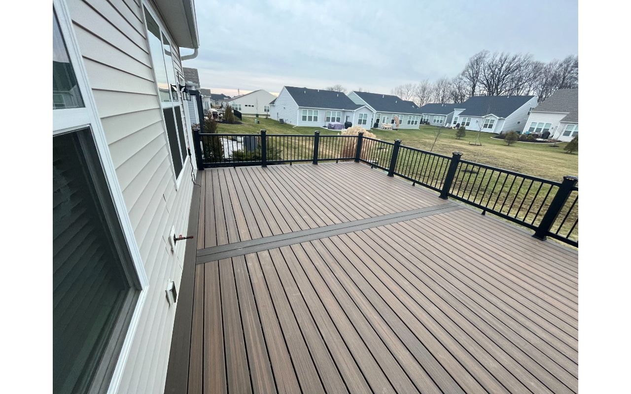 Not much can beat Toasted Sand decking complimented by Coast Bluff for the accents and Charcoal Black railing
