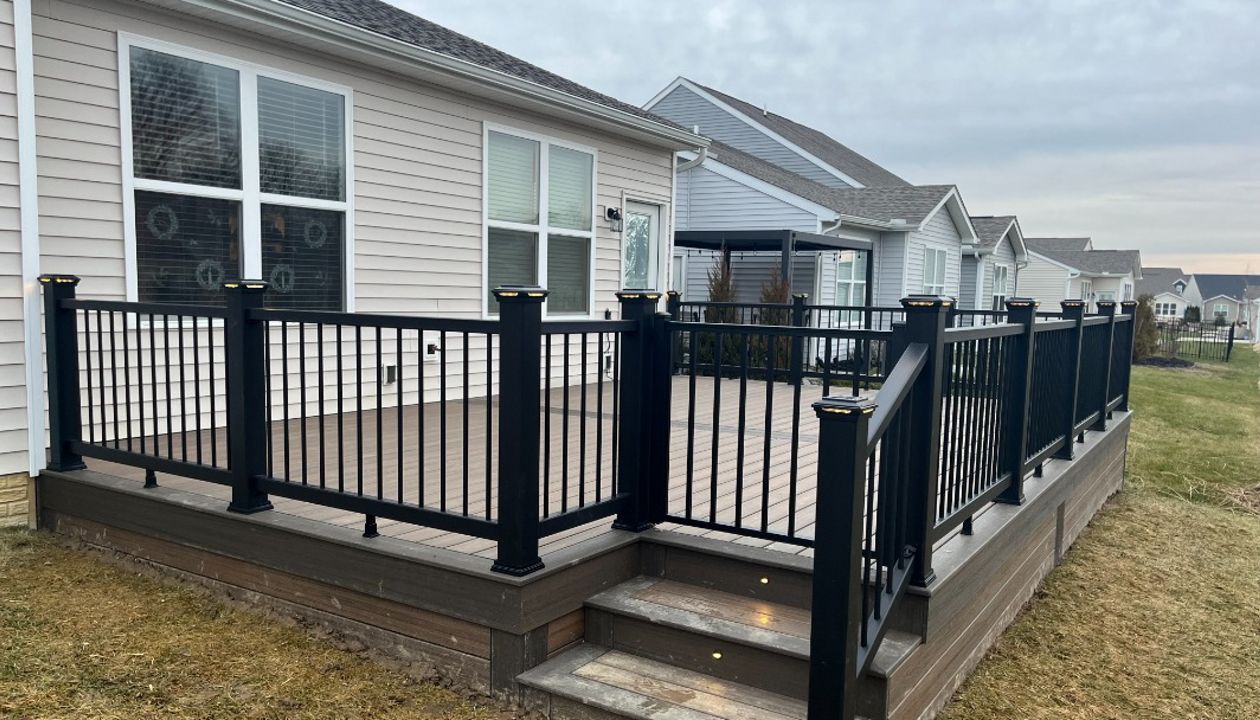 Not much can beat Toasted Sand decking complimented by Coast Bluff for the accents and Charcoal Black railing