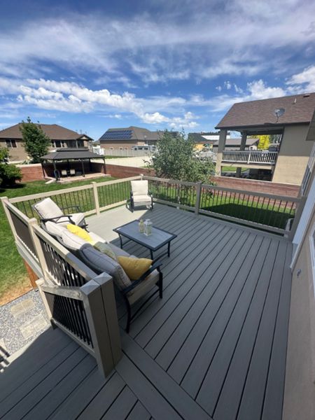 This deck shines with the rich Tide Pool color, paired perfectly with low-maintenance vinyl railing and sleek metal balusters for a modern, durable finish. Style and strength, all in one beautiful package.